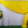 aluguel de painel de cortinas amarelo e branco com flores de girassois